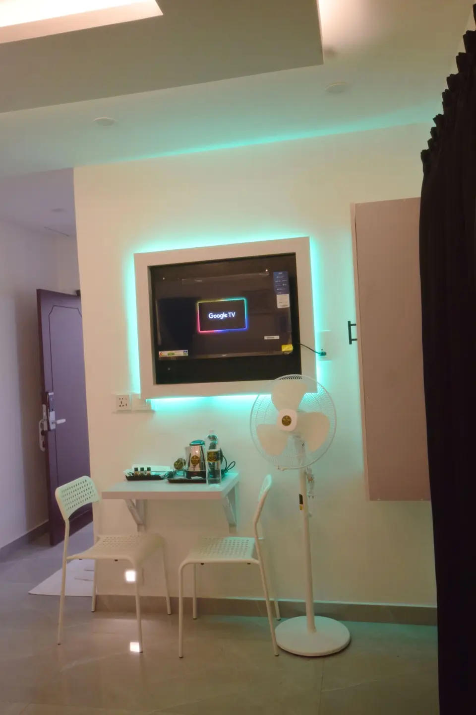 Room with Google TV, ambient lighting, table and tea tray