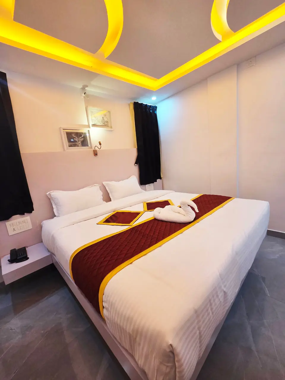 Family Double Room with towel swan on a freshly made bed
